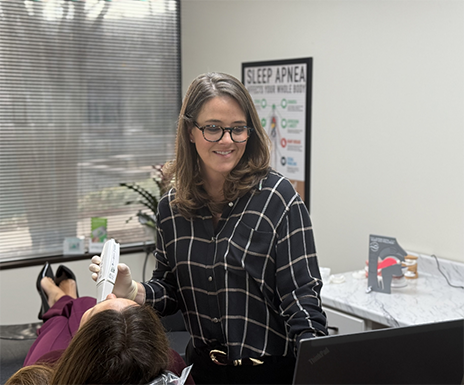 Doctor Ardovino taking digital scans of a patient's teeth