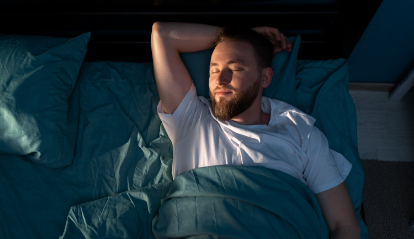 Man sleeping soundly after sleep apnea treatment in Hoover