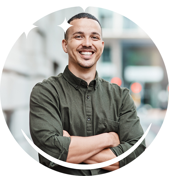 Man in a dark green button-down shirt smiling