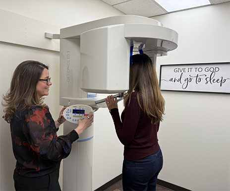 Sleep apnea patient getting a cone beam CT scan of her jaws and airway