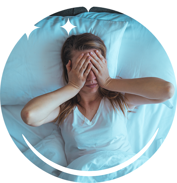 Woman laying awake in bed due to obstructive sleep apnea in Hoover