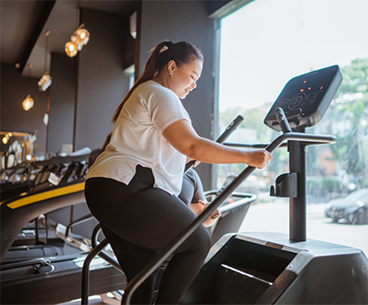 Woman using an elliptical machine