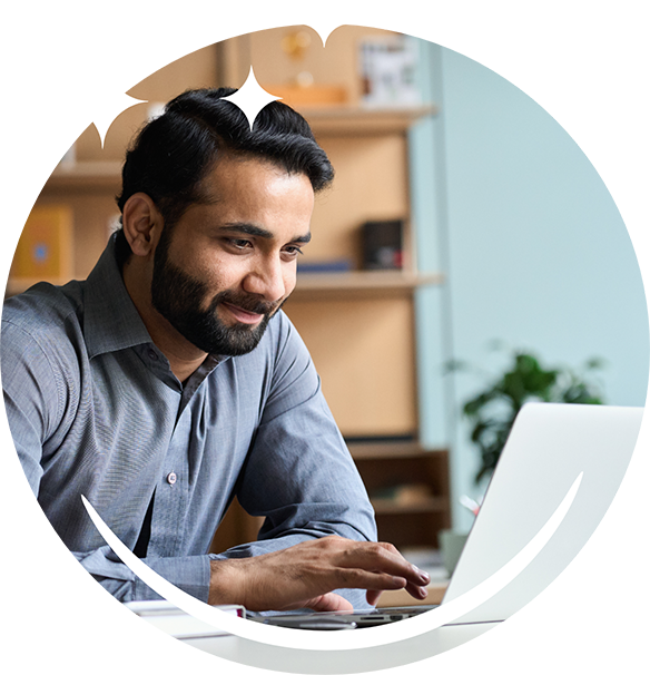 Man using his laptop at a table